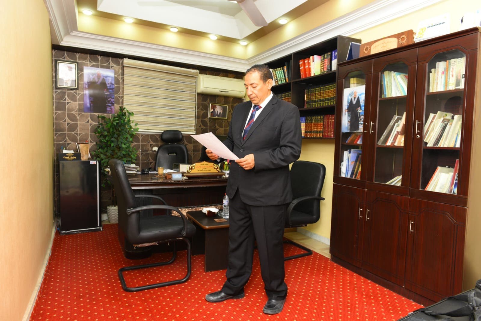 Mohamed Reda reviewing a file in the Hurghada office